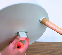 The water level sensor held in a hand, glowing red