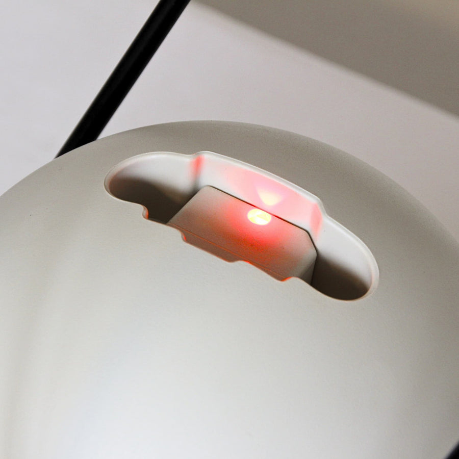 The refill light glowing at the base of the Egg