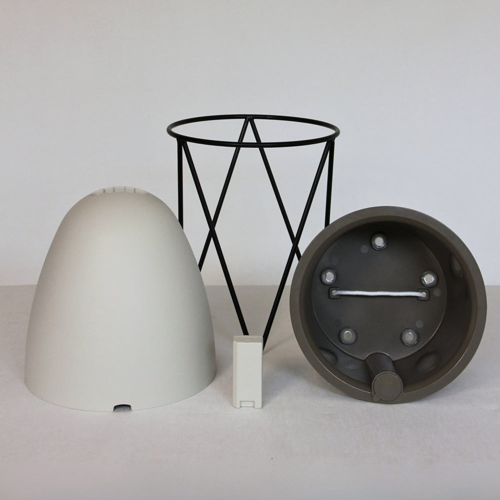 The Egg taken apart: outer pot, inner basket, sensor and cast iron stand