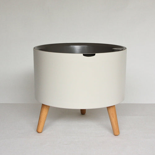 thirstypot round planter with short legs studio shot from front